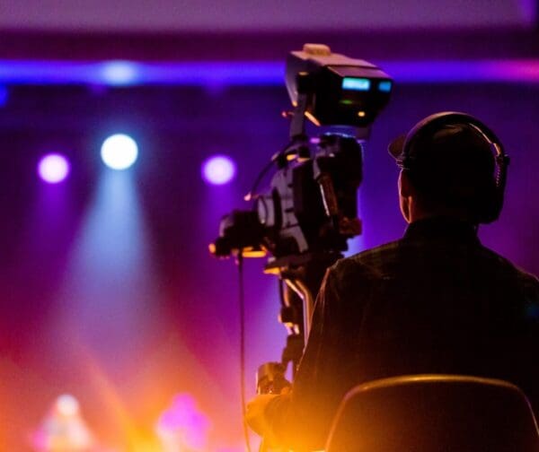Cameraman with Headset filming a live show